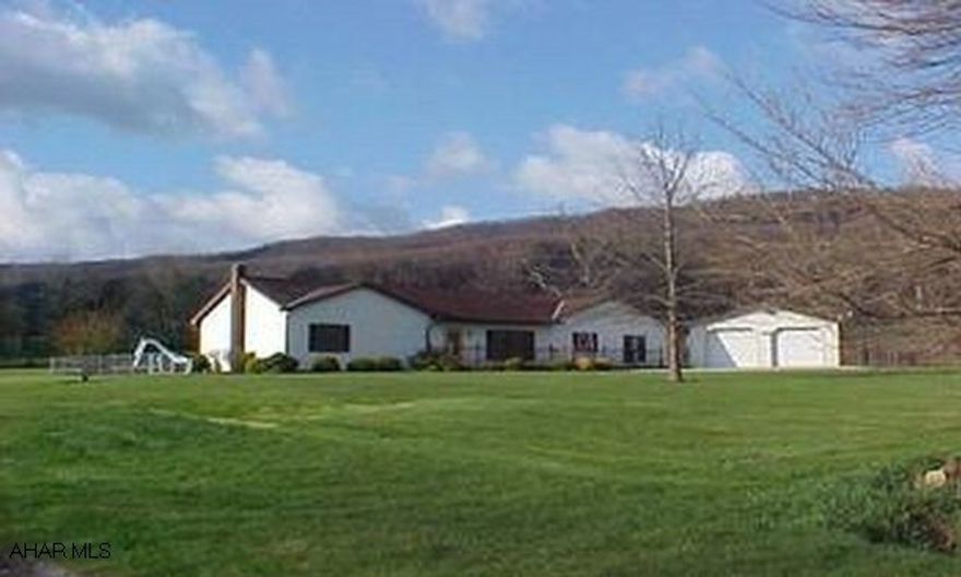 Beautiful country home on 1 acre. New maple kitchen with large island counter, first floor family room with propane heater, central air, inground pool and 2 car detached garage. #J-036