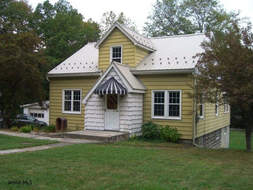This lovely Cape Cod home is situated on a large private lot between state game lands and is only 5 miles from Prince Gallitzin State Park. It offers a newly remodeled large master bedroom with a walk in closet on the first floor and two spacious bedrooms on the second floor along with a den/office. There have been many improvements and updates made to this home to include a totally redone bathroom, updated wiring (200 amp) and thermo pane double hung windows with a transferable warranty. The exterior is maintenance free with a metal roof, siding and capped window trim. There is plenty of parking and a large two car garage.  Call for an appointment today.