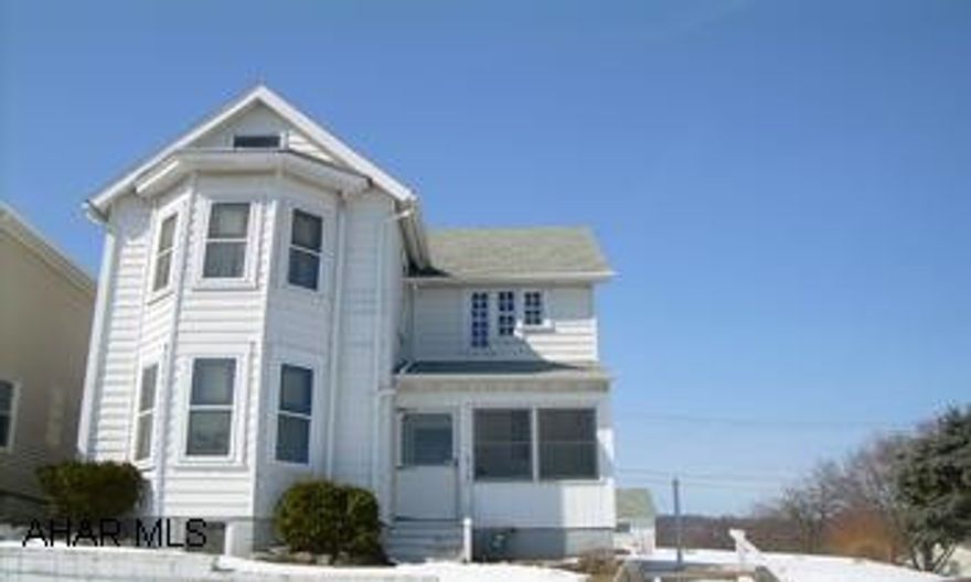 2 1/2 Story Aluminum sided Home Nice 2 story in a very desirable neighborhood on a nice sized lot.  Updated electric service, newer roof, newer kitchen cabinets.  First flr. laundry.  Good sized rooms.  Bring your ideas and make it your home.  Don't miss out on this one.  Call Hank