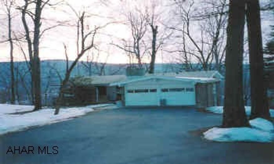 Custom built stone ranch, private yet close to town, beautiful view. Great view from most rooms, excellent condition, one owner.