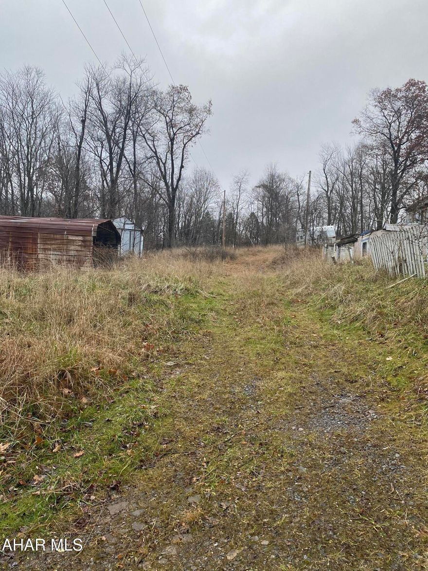 Discover the perfect blend of privacy and convenience on this secluded vacant parcel, offering sweeping natural views in every direction. Tucked away from the noise yet only a short drive from everyday amenities, this property provides the ideal setting for your dream home, weekend retreat or investment build. The land features a well already in place and an installed septic system, giving you a vauleable head start on development. With its peaceful surroundings, open space and picturesque landscape this property invites you to imagine endless possibilities - whether you envision a cozy cabin, modern retreat or simply a quiet escape.