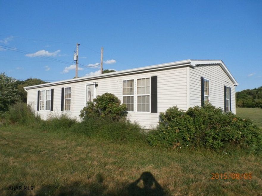 Quiet location. 3br/1bath dblwide with main level laundry has a full unfinished basement.Needs a new roof and some basement wall work done.