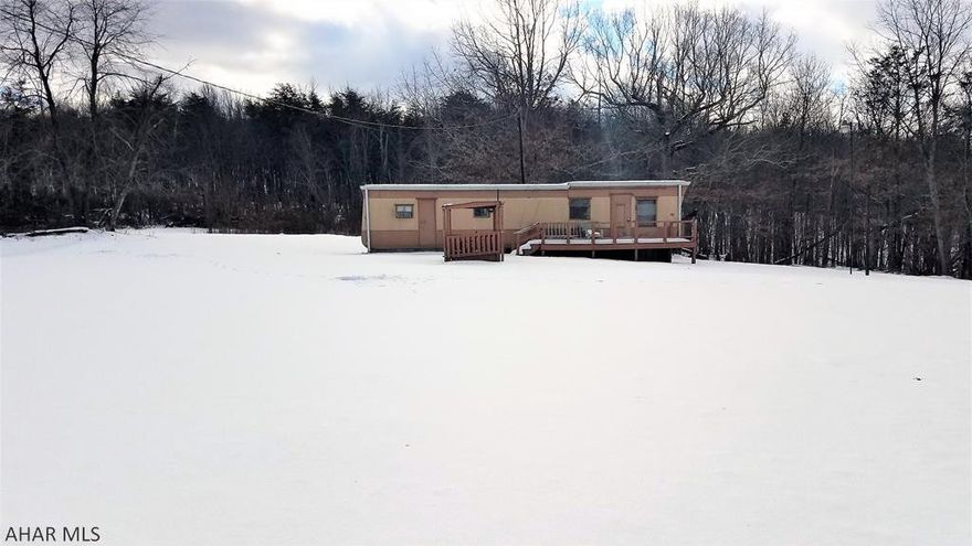 Are you looking for a piece of land to get away? Do you love hiking, hunting and nature? Come have a look at 58 acres of heaven, with a trailer, electric, well and septic.   This could become a great building site for your dream home or cabin. This secluded, level to hilly parcel is a mixture of open and wooded land.  Trails are cut through the property; use them to hike, bike or ride your ATV.  There is a nice mixture of mature and young trees, including oaks, maple, cherry and locust.   It's located close to Shawnee State Park, and centrally located between Pittsburgh, Baltimore and Washington DC.  The acreage amount is taken from a survey and varies from the tax card; buyer is to verify.  The propery is being sold "As-Is".  Four wheel drive recommended for the winter season.