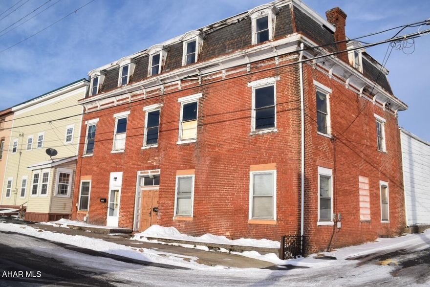 This one is for the investor who sees  the  potential and satisfaction in bringing a historic property back to life.  The former Murray Hotel, built in 1850, once served the needs of people traveling the Pennsylvania Canal in Hollidaysburg.   There are two residential apartments on the first floor, one of which is occupied.   This sale also includes the single family property at 312 Blair St. which is also tenant occupied.  The parcels of both of these properties adjoin.  This is a unique opportunity for the right person to bring a part of Hollidaysburg's history back to life.