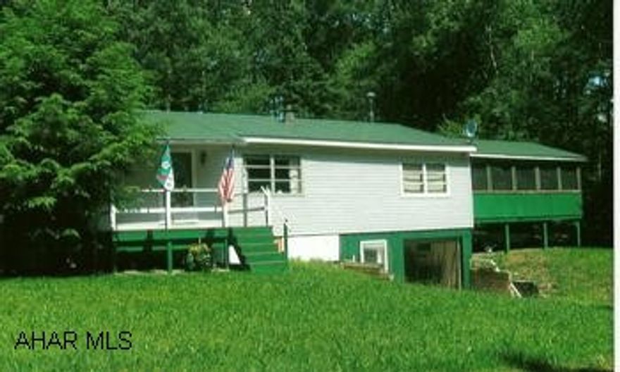 Secluded cottage on 1 acre lot close to Eagle Lake, surrounded by 1000 privately owned acres which adjoins state game lands. Nice getaway ranch home , very good condition with large 20x24  screened porch. Great vacation home, amenities include use of large lake for swimming, common beach area and playground, fishing, hunting, hiking. Must become a member of Valley Hi Association. New metal roof and siding in 2006.