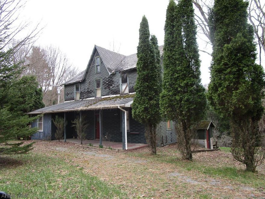 Sold AS IS.  House needs complete renovation - not livable in current state.  Not financable in current condition - may qualify for a renovation loan.   Nice two car detached garage. Lots of land and private location. Curwensville schools. Pond on property. Would make a great camp.