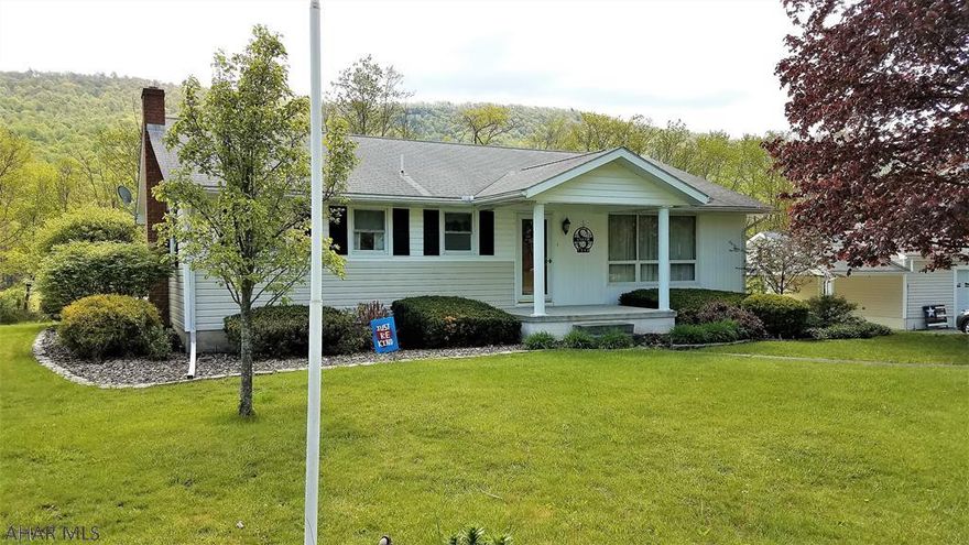 Are you looking for a move in ready home in a rural setting?  Are you ready to get out of the city or buy your first home? Look no further, this charming home has been meticulously maintained.  There's plenty of cabinet space in the kitchen, which features a corian counter top, ceramic tile back splash and breakfast bar. Sitting on one acre of gently sloping land, enjoy nature watching from the comfort of the rear deck or in the family/sun room.  The oversized two-car detached garage has plenty of space for your vehicles and lawn equipment.  The covered patio attached to the garage is a great place for a swing.  Come take a look at this little slice of heaven, you may want to make your own.