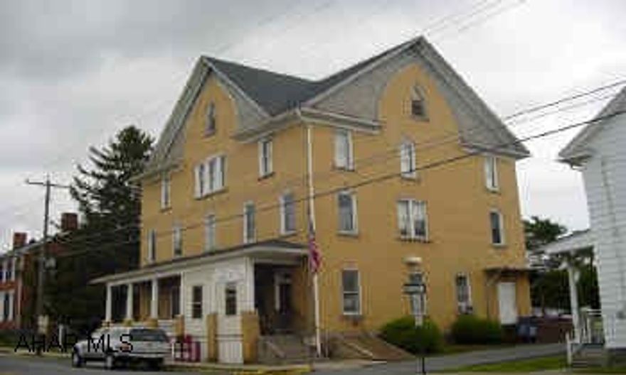 Large three story brick.  Two apartments, office rental, and large open spaced thrid floor.  Great Investment! Large divided shed. Three story brick, with lots of rental income potential.