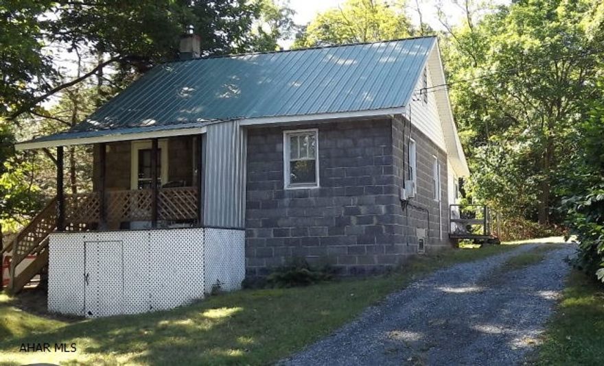 Nice buy on this 2 bedroom, 1 bath home with a great location! Updates include kitchen cabinets, furnace, metal roof, water pump, electric. All appliances stay. Close to I-99 and 10 minutes to Blue Knob.
