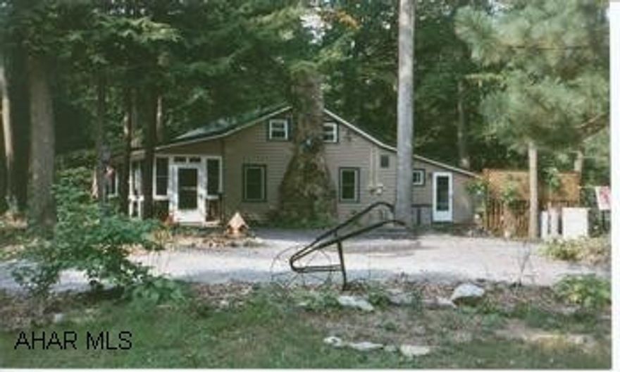 Sweet cottage for year round use or weekent getaway! All modern conveniences. Newer windows, roof, & siding.  Lovely treed lot with two streams.  Hot water tank & stove are propane.  "Seller will consider all reasonable offers." Twin Creek Villa.  Sweet cottage for year-round use or weekend getaway!  All modern conveniences.  Newer windows, roof and siding.  Lovely treed lot with two streams.  Hot water tank and stove are propane. "Seller will consider all reasonable offers."