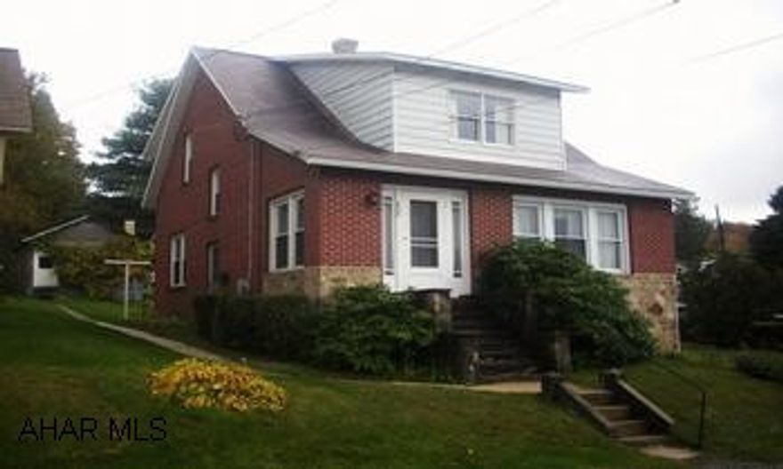 1 1/2 story brick cape cod on quiet street. Address is Central City, PA 15926, school district is Shade/Central City Original hardwood floors throughout, 6" wide oak trim throughout with original oak french doors to Living room. Swirled ceilings in Living Room and foyer.