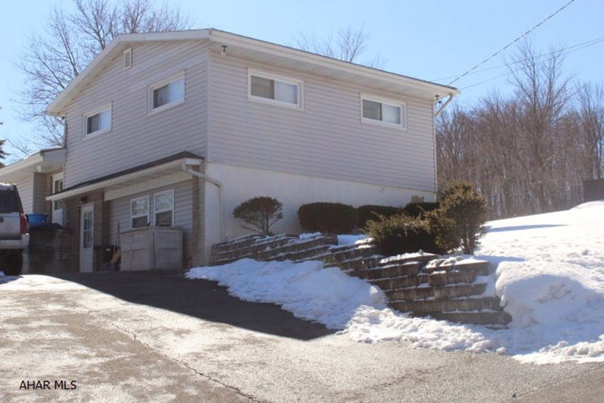 Location, Location, Location....Charming home with loads of potential in desirable neighborhood, In Ebner Elementary School District.  Underneath carpet is hardwood flooring, Easy access to large covered porch through mud room or sliding glass door from eat-in kitchen. Nice size yard.  Garage was converted to be part of basement, but can easily be converted back into a garage.  Lower level basement is heated and has a family room area, a bonus storage area, and a heated utility room.  This is a must see, lots of usable space.