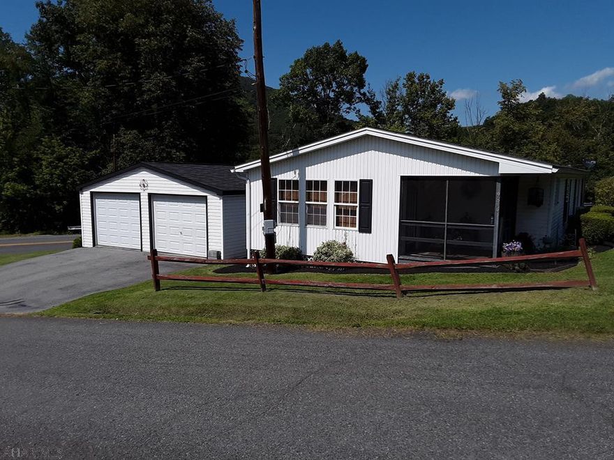 Nice well kept home with detached two car garage!  This home offers 3 bedrooms with 2 full baths!  Convenient main floor living in town with easy access to the main road!  Short trips to the IGA and the schools!  If you like to fish or enjoy the river its just over the hill.  If you are down sizing or looking for an easy to maintain property check this one out!