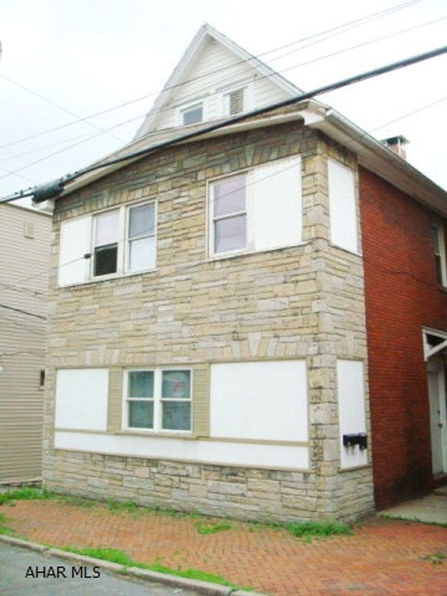 Completely renovated 2 unit rental top and bottom. Detached 3 car garage, remodeled kitchens & bathrooms in each unit. Double pane and tilt-in windows everywhere. Three bedrooms, large living room and dining area on each floor. Separated gas and electric utilities. Large basement with washer and dryer. Off street parking. All of the hard work has been done. Must see. SELLER WILL CONSIDER ALL OFFERS.