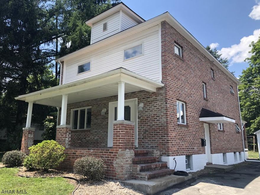 2 1/2 story brick & vinyl sided totally remodeled 4-5 bedroom home on large level corner lot.  First floor consists office with lots of cabinets and desk area, laundry, LR, DR, Foyer, eat-in kitchen with bar area, and full bath.  Second floor consists of 3 nice size bedrooms and the master bedroom suite has a full bath with separate sinks and a walk-in closet.  Third floor could be a 5th bedroom or play area/rec room.  Total finished living area is approximately 3,400 sq. ft.  Hot water radiator natural gas makes this home easy to heat.  Large front and back porches.  1+ car detached garage.  All you need to do is bring your furniture & clothes to move into this "like new" home.  Don't let this one get away!