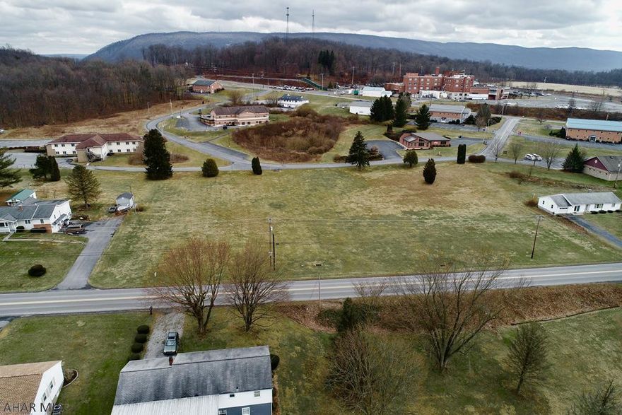 This prime location on 2.2 acres is wonderfully situated at a busy intersection next to the Bedford Hospital and doctor's offices and conveniently located between Bedford and Everett off of Lincoln Highway.  Shopping is literally minutes away and the site lends itself to a multitude of business endeavors such as apartment complex, doctor's offices and/or residential homes.  City sewer is available and city water is within 600' of the site.  Truly a great level lot in a prime location.