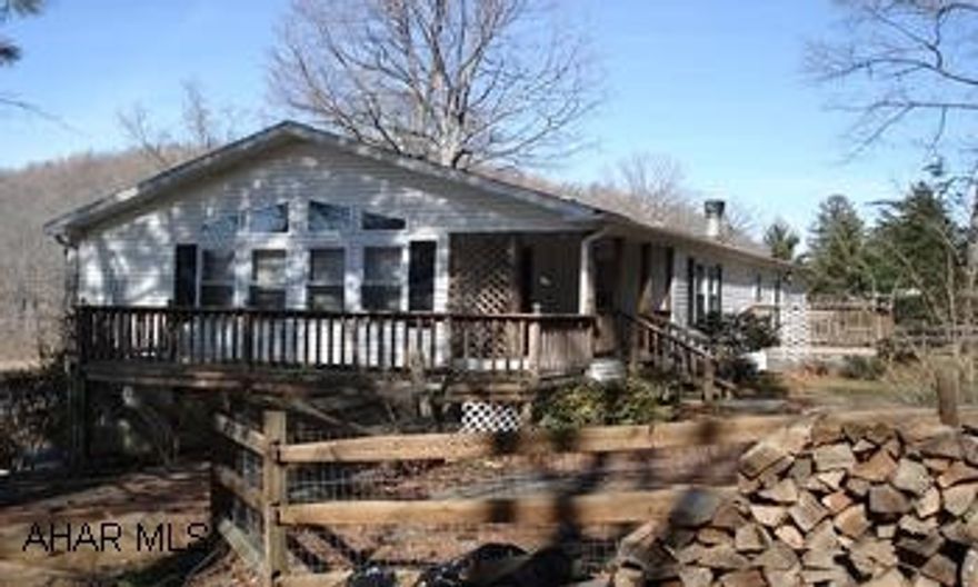 Plus $ 5,000 Seller Assist. Almost 1 acre near State Game Lands. Very well maintained 1568 sq.ft., 3 BR, 2 BA, ranch-style home w/ full bsmt. Oak cabinets, stone f/p, finished sunroom PLUS 3 decks! Nice setting & location! 15 miles to Bedford or Maryland, 5 miles to Buchanan State Park, 4 miles to Lake Gordon & Lake Koon. $ 5,000 Seller Assist. Call Karen at 814-585-7700.