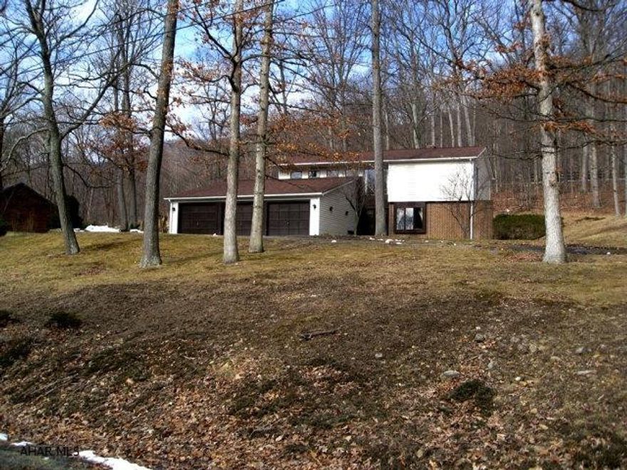 Move in ready, in great location just minutes south of Bedford. Newer heat pump, roof, carpet and appliances. Large master bedroom w/ master bath. Dining room and living (which includes fireplace) both open onto deck. Three car attached garage. Priced to sell!