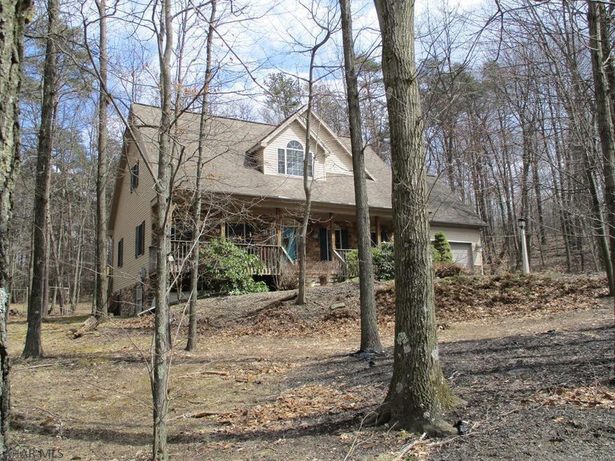 Here's a great opportunity to purchase a home in the sought after Lakeland Pines neighborhood, located 5 minutes from Lake Raystown, Seven Points Marina and the Allegrippis Bike Trail. At Lakeland Pines you can enjoy the trails to the catch and release pond, gazebo and much more. This home has vaulted ceilings, lots of natural light, columns, and a beautiful view from the large deck for entertaining friends and family. Great home to live year round or use as a seasonal get-away.  Inside of home recently painted. Seller says bring offers!