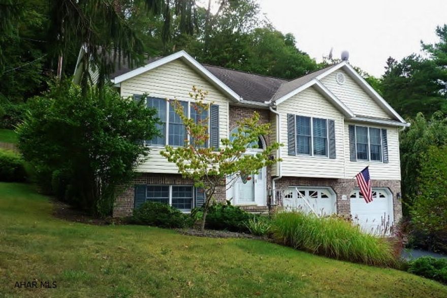 Very lovely 3 bedroom, 2 full bath brick and vinyl raised ranch with deck, patio and beautiful landscaping. Features cathedral ceiling living room, custom kitchen with breakfast nook, spacious dining room, master bedroom suite with full bath and finished basement with family room and den/office. Convenient location close to town and schools.