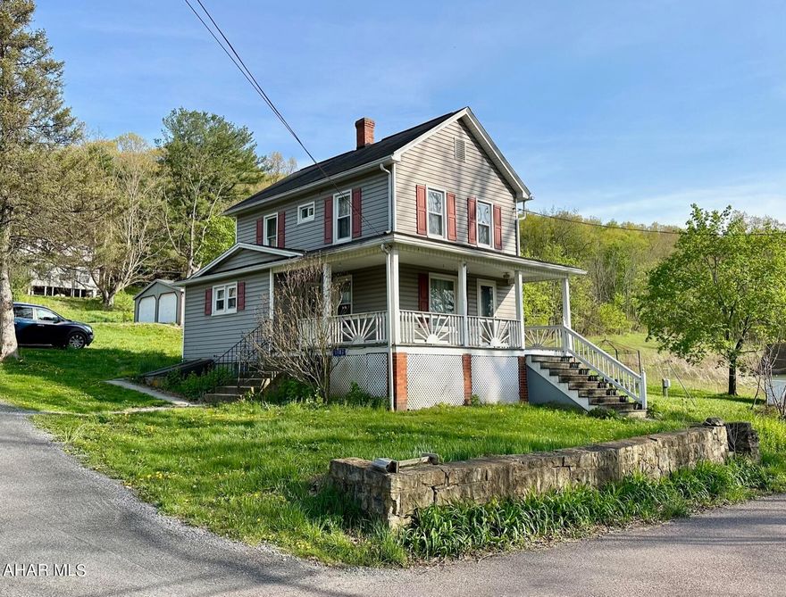 Nicely maintained two story home on almost 2 acres with easy access to I99 in Claysburg School District.    Kitchen with bar height seating for two, opens to dining area with hardwood floors and nice sized living room with access to the wrap around porch.  Updated full bathroom on the second floor and a newly updated 1/2 bath in the basement.   24' x 30' utility garage as well original 16' x 20' garage.   Give us a call to make this your house your new home!