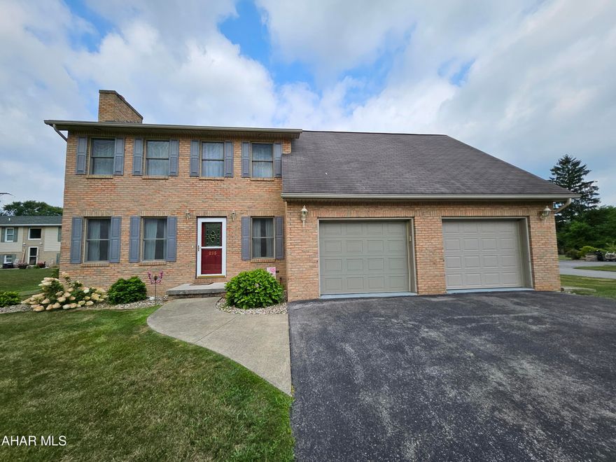 Welcome to Antis Township! This impeccably maintained and updated two-story home boasts exceptional curb appeal with its charming brick front and a spacious two-car garage. Enjoy the seasons in the expansive, flat yard featuring an oversized, fenced deck with an awning, plus a handy shed for extra storage.
As you step through the front door, you'll immediately notice the stunning new hardwood floors that extend throughout the main level. The dining room is highlighted by a large brick fireplace and generous windows that flood the space with natural light. This room seamlessly connects to the sizable eat-in kitchen.  And where do we start with the kitchen? It's a chef's dream, with a huge double window, a wet bar, and a secondary sink. The custom cabinetry (don't miss the swing-outs in the pantry), adorned with charming trim, complements the stainless steel appliances, all thoughtfully arranged for easy entertaining. The kitchen's eating bar opens up to the large family room, making this space perfect for gatherings.
The second floor features a very convenient laundry area, two master bedrooms, each with its own unique charm. Beautiful pine floors enhance the character throughout this level. The main master bedroom impresses with a vaulted ceiling, a brick fireplace, a 9x5 walk-in closet, and a luxurious 12x11 master bath complete with tile, a jet tub, and a step-in shower. The second master bedroom, measuring 17x13, includes a double closet, barn-style ceiling with a fan, and recessed lighting.
Ample storage is available throughout the house, making it ready to welcome and accommodate its next family.