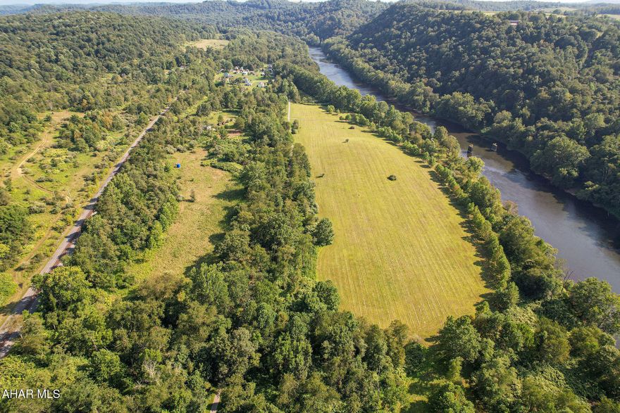 RIVERFRONT PROPERTY! Ready to unwind and take in the beauty of Pennsylvania's nature? This 32 acres retreat sits right along the Conemaugh River and the West Penn Bike Trail. The property offers electric hookups for three campers, a two-car garage for all your recreational gear, and a mix of flat land and rolling hills. The camper hook up is brand new with 400-amp service grid if you want to build your next Home Sweet Home. The views are breathtaking! 2,000 ft river front! Spend your day kayaking on the river and wind down by the fire pit. This river property awaits your personal touch!