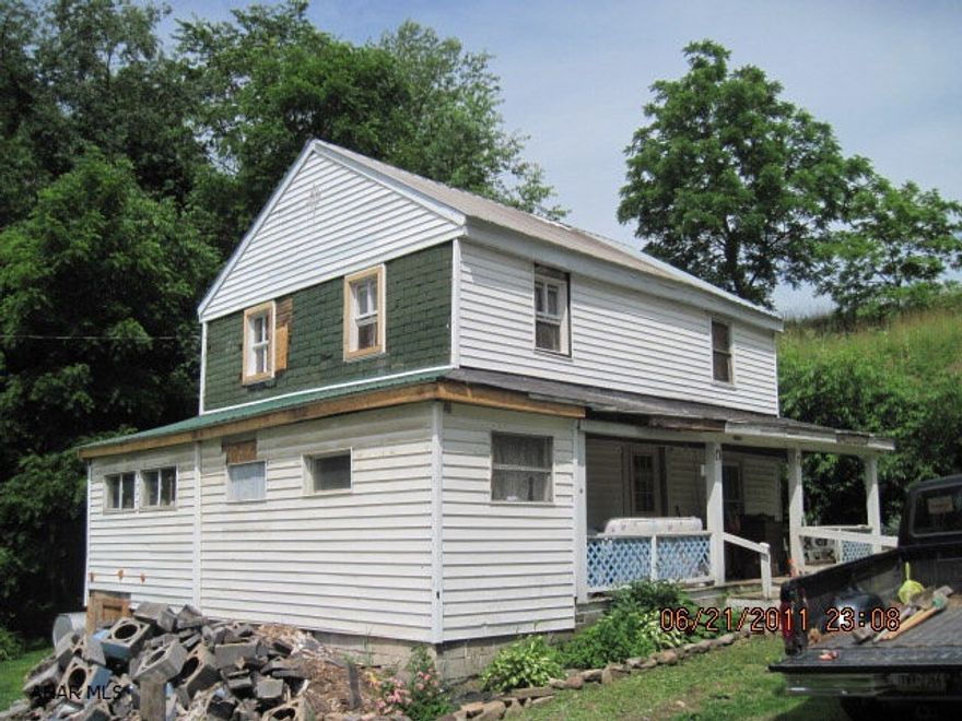 Beautiful 65 Acres, Mostly All Tillable Ground, Being Farmed At Present By Tenants, Old Farmhouse, Log Cabin with well water,electric. Log Shed, Cave On Property for storage. Barn, pole shed,Townships Road through Property.40-60 corn grids one full size one half size with elec. Ground Is On Both Sides Of Road.
