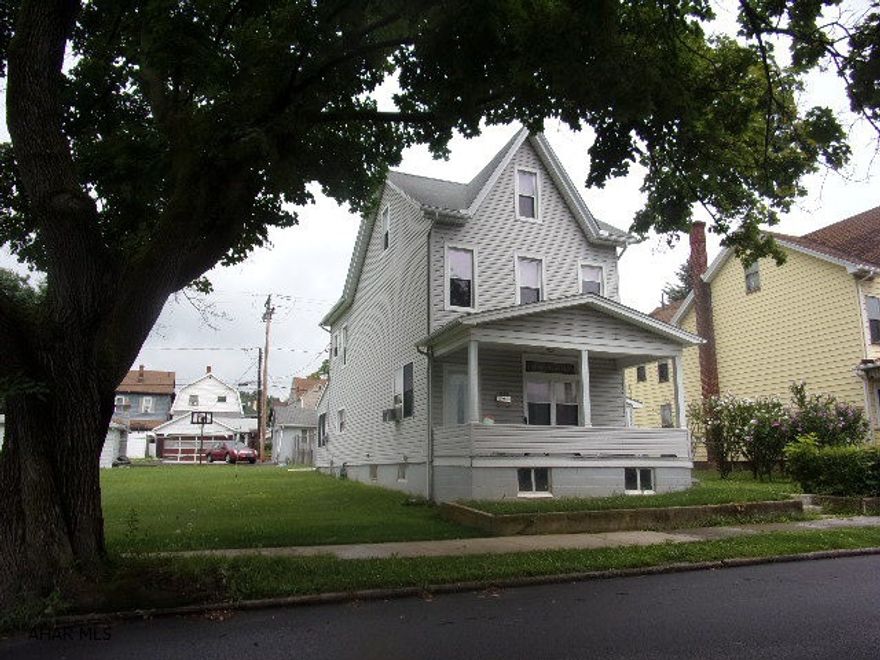 Lots of room, inside and out!  3 or 4 bedrooms, first floor laundry and finished attic.  Replacement windows and vinyl siding.  Nice sunroom off kitchen.  Two detached garages, 1-car with storage, and a 2-car detached.  Garden area and partially fenced lot, along with off-street parking.  Lots of bang for the buck!