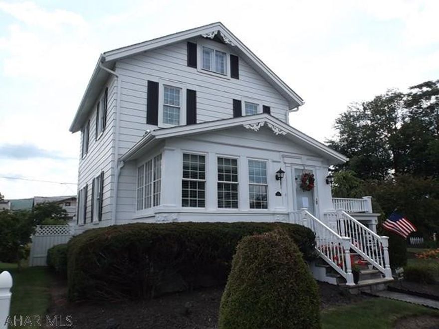 A REAL MUST SEE! Located on a cul-de-sac this home features many upgrades: thermopane windows, roof, partially finished basement, beautiful flooring, built in bookcases.  The spectacular yard/garden areas are neatly groomed and feature many flowering plants that bloom through the summer.  Enjoy the warm summer breezes under the carport or in the pergola.  Beautiful entrance walkway installed only a few years ago.  Garage has a work area with a second floor hoist.  Enclosed front porch has been furnished as a sitting area but could be a den or office.  Note the window seat which opens for storage.  Crown moulding in some rooms.