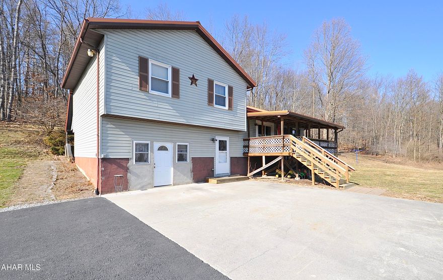 Wow! This wonderful hillside split level has so much to offer and an affordable price. Inside you'll find a unique main level with double living room, eat in kitchen and vaulted ceilings. The upper level contains 3 cozy bedrooms and two large bathrooms. Lower level is one large room that could be used for anything really, including professional office with separate entranceway. Lowermost level contains laundry and large finished room that is perfect for really any use. Propane wall stove is owned, propane tanks leased, water conditioning system owned, all appliances are included including pellet stove. Lots of room for gardening and the outbuildings to house all of your equipment. See this soon it will not last.