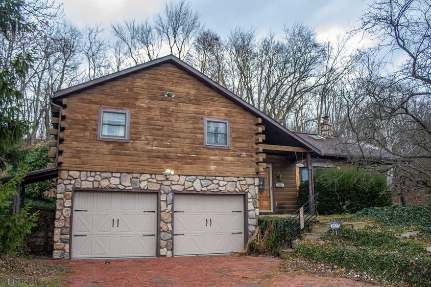 White Pine log home in the Juniata section of Altoona, conveniently located near Penn State Altoona and close to local amenities. Large lot with plenty of privacy. Features include: open floor plan with vaulted ceiling, Quartz countertops, stainless steel appliances and wood burning fireplace. Check out the 3D tour!