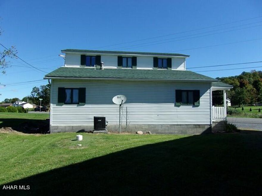 TWO LARGE APTS., PLUS a Single Family Home
on over half an acre with public water and sewage.  Units are all well maintained.  House has newer carpeting and there is a new roof on both buildings, even the storage shed.  Heating sources include electric baseboard, heat pump, and an oil furnace.  Apt A has hookup for a propane furnace and a propane heater on site, but it is not in use. It's nice to have a area outside to relax and this property is not lacking. Each unit has outdoor living space - A large balcony, covered concrete patio,.   The house has a long covered porch.