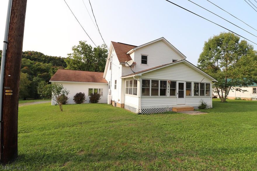 This recently updated 4 BR 1.5 BA home sits on a large semi-private 3 acre lot. It features a large deck overlooking the yard with a fenced in area, shed and playground. This home features first floor laundry, large rooms, workshop, storage above the breezeway and public water and sewer.