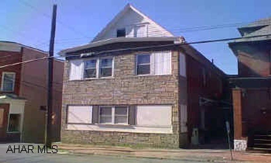 2 story stone & brick exterior, seperate utilities. Very nice, well kept, Apt. building. Stone & brick exterior. Seperate utilities. Det 2 car garage in rear.