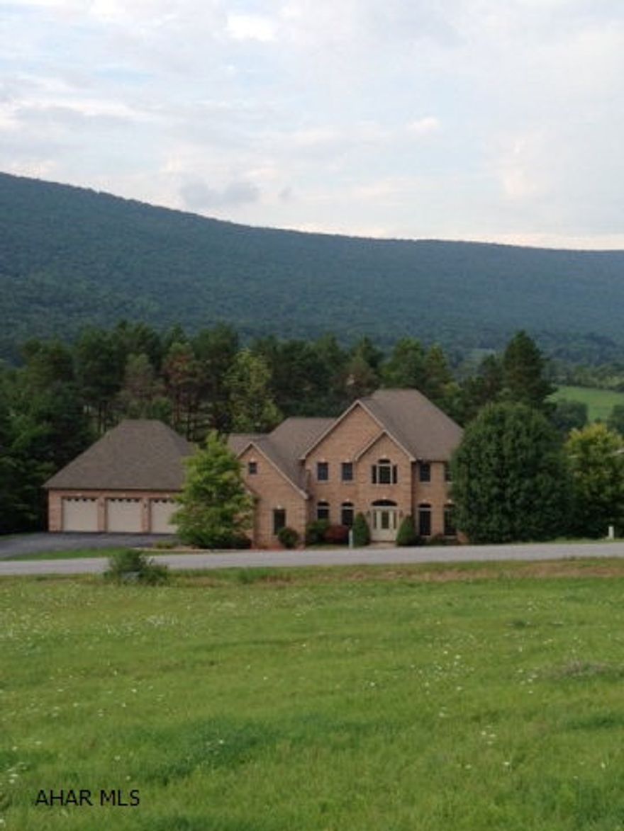 Over 4000 square feet of finished living space in this lovely home on 1.25 acres. Amazing kitchen with natural cherry cabinetry, granite, large island, that opens to eating area and great room. Double doors open to back deck w/ spectacular mountain views. Great master suite. Finished lower level with fireplace and bath opens to back patio and yard. 5 car garage - boats, sports vehicles - room for all! Plus utility garage.