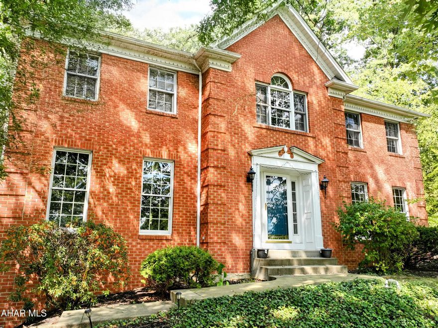 Gorgeous 4 bedroom, 4 bathroom, solid brick home situated on over 1/2 acre in Hollidaysburg School District.  Formal living and dining rooms with 6' windows let in lots of natural light.   Solid oak flooring on the main floor, family room off the kitchen with a wood burning fireplace.  Kitchen includes all new appliances, granite counters, recessed lighting and study/desk area.  Lovely back patio area nestled among the oak tree filled yard.   Spacious primary suite with walk-in closet, shower and large soaking tub.  Three additional bedrooms and a full bath round out the second floor.   Partially finished basement with 1/2 bath and a 2 car integral garage.   An outstanding home that is sure to impress!  Give us a call today!