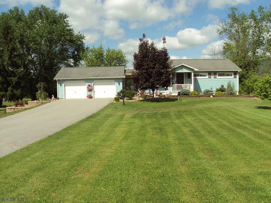 Nice Home!  Private Setting...Live out but very convenient!  4 Bedrooms and 2 Baths.  1 Bedroom and Bath in Basement.  Sunroom off of Master Bedroom.  Remodeled kitchen.  2 car garage.  2 acres.  Lots of out-buildings.  18'x'36'12' carport with 38' camper included.  Home not in flood plain.