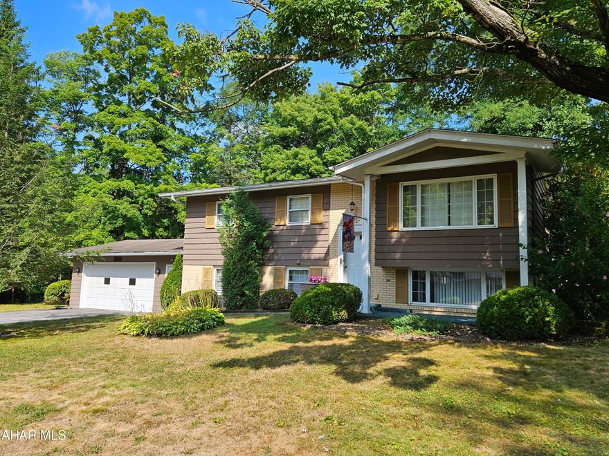 Tipton bilevel with a beautiful, private lot.  Cul-de-sac with a small creek for peaceful sounds.  2 large bedrooms on the main floor and 2 possible bedrooms in the lower level.  Each floor has a full bath and the lower level has a large family room with wet bar and walk out to a nice patio.