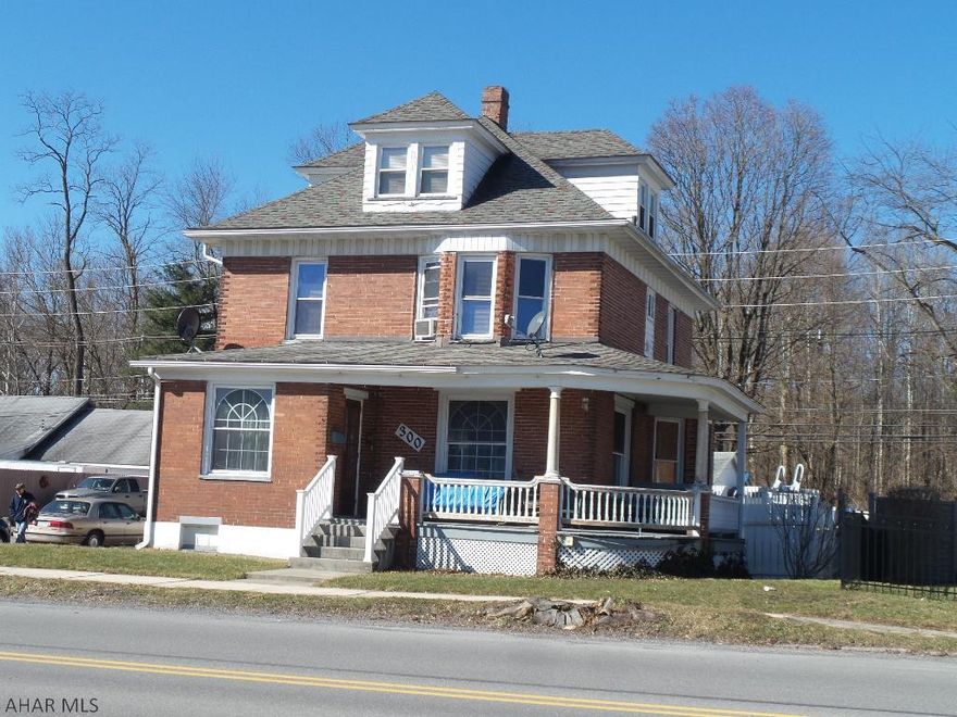 All brick with wrap around porch.  This 4 bedroom features and updated kitchen, first floor 1/2 bath and laundry room.  Living room with hardwood floor and gas fireplace.  Formal dining room with custom bay window.  Finished basement with 3/4 bath. The third floor could be a large bedroom.  Fenced back yard with above ground pool and hot tub.  Detached 2 car garage