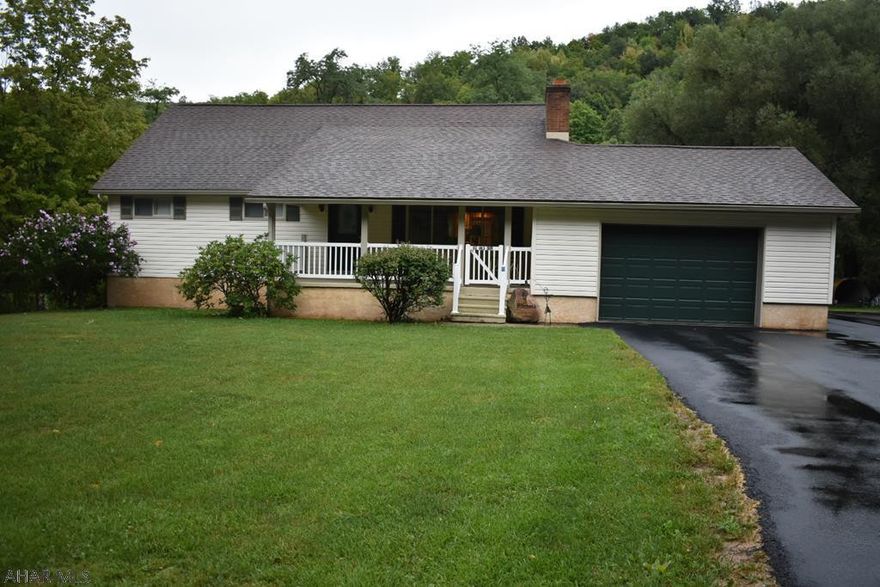 Don't miss the opportunity to view this well kept, spacious 3 br 1 bath home in a quiet location on a nice level lot.  This home offers main floor living, a large eat in kitchen and newly paved, oversized driveway, a wood burner in the family room and a pellot stove in the basement.  There Is a bonus room upstairs that could be utilized as an office/den, closet or another bedroom.  Current owner has a bedroom upstairs and used the other room as storage.  There is a large outbuilding with oversized garage doors currently utilized as a boat motor business, has heat and a bathroom.