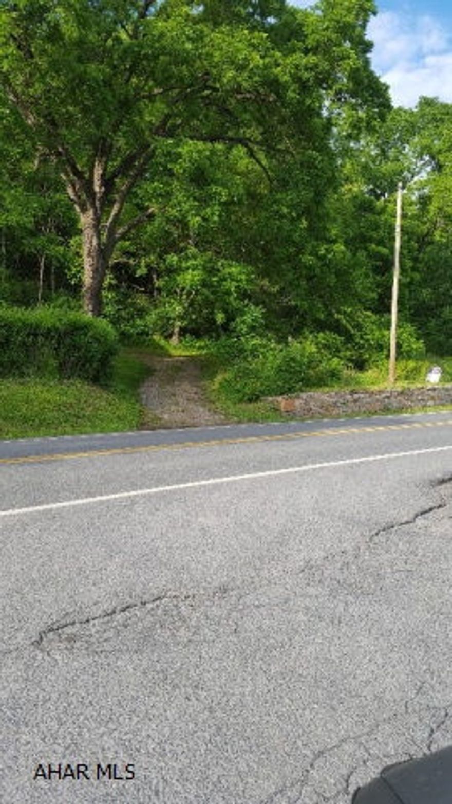 this property is two acres and  foundation needing tlc, on sunny side road. Would make a nice spot for a home.