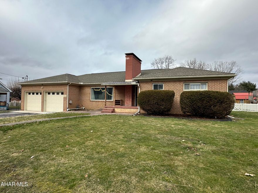 Large one story brick home with beautiful outdoor living area, covered deck, hot tub, fenced in yard, 36 x 24 steel pole building with garage door from alley and garage door into the yard,  huge living room and dining area, eat-in kitchen, main floor laundry with utility area, 3 bedrooms, 2.5 baths, remodeled main bathroom, attached two car garage, basement could be finished, central vac, newer roof, sewer compliant, new front window is being installed