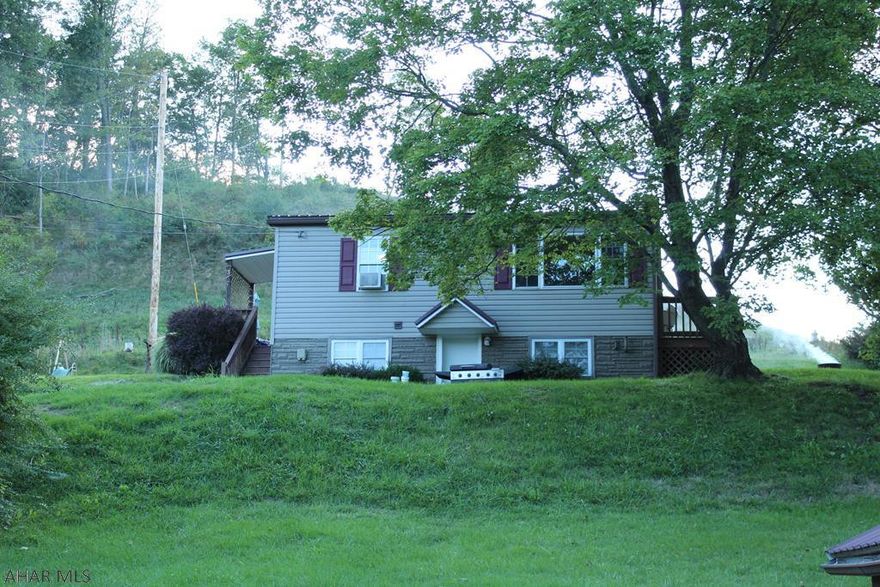 This cozy 2 bedroom, 1 bath home is move in ready and waiting for you! Gorgeous refinished hardwood floors in the kitchen, newer roof, nice sized deck and side porch and a one car detached garage, come and see everything this home has to offer.