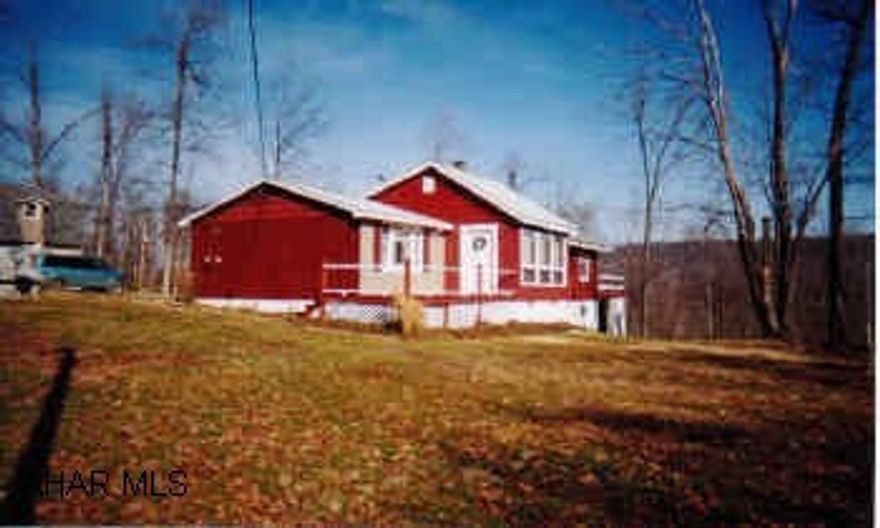 Ranch, 3 bedrooms, 1 bath, living room, dining room and large kitchen. Rustic summer home at its best.  A view to die for.  Road maintenance $100 a year.  DIRECTIONS FROM HUNTINGDON:  Rt. 22E turn R on 522S-go 17 mi make L on 641E go 2.6 mi make L at McMullens Hillside Pheasant Farm sign, over wood bridge bear L, at "Y" stay to R go approx. 1 mi up gravel road, house on top on L.  Look for sign.  FROM TURNPIKE:  Exit 14 Rt 997 to Roxbury then take 641W  thru Spring Run & Neelyton, past Clarks garage, turn R over wood bridge bear L, at "Y" stay to R, go up gravel road, house on top on L.  Look for sign.