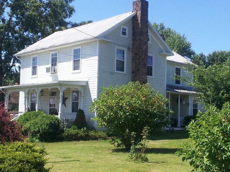 2 story home with lots of charm and character.  Large rooms, new windows, several outbuildings, eat-in country kitchen with stone fireplace and pellet stove.  Convenient location.  Close to Chestnut Ridge Schools and Fishertown Market.  Lovely level yard with garden, lots of flowers and beautiful trees.