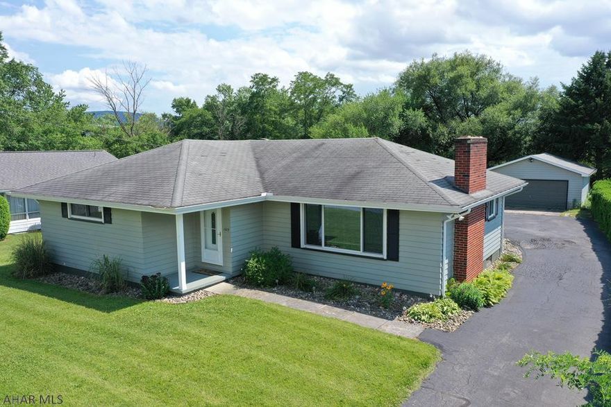 Amazing 3 bedroom, 2 full bath, ranch style home in the Hollidaysburg Area School District.  The living room and dining room are open and have hardwood flooring.  There is a large window in the living room that brings in lots of natural light.  The three bedrooms are all on the main level.  The master bedroom features bamboo flooring.  There is a partially finished basement with 2 bonus rooms and a full bath.  There is also a bar area, laundry area, and a fireplace in the basement.  Other features of the home include a detached 2 car garage, large driveway, enclosed back porch, and patio.