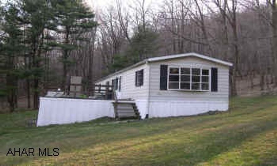 Very nice 2BR Mobile Home on +/- 12 acres adjoining 1,100 acres of State Game Lands. Enough land for your horse.
