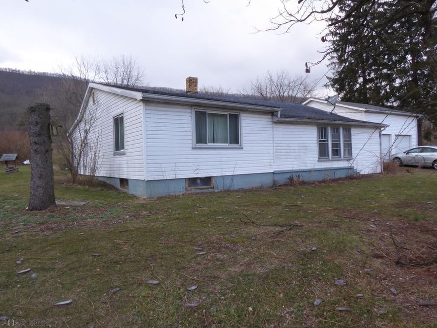 Motivated seller! Great piece of property with a large detached garage on a "cul de sac".  The home can be a great investment property or personal residence. This home needs some TLC and is being sold AS-IS.  Close to all the major highways, conveniences, and town.