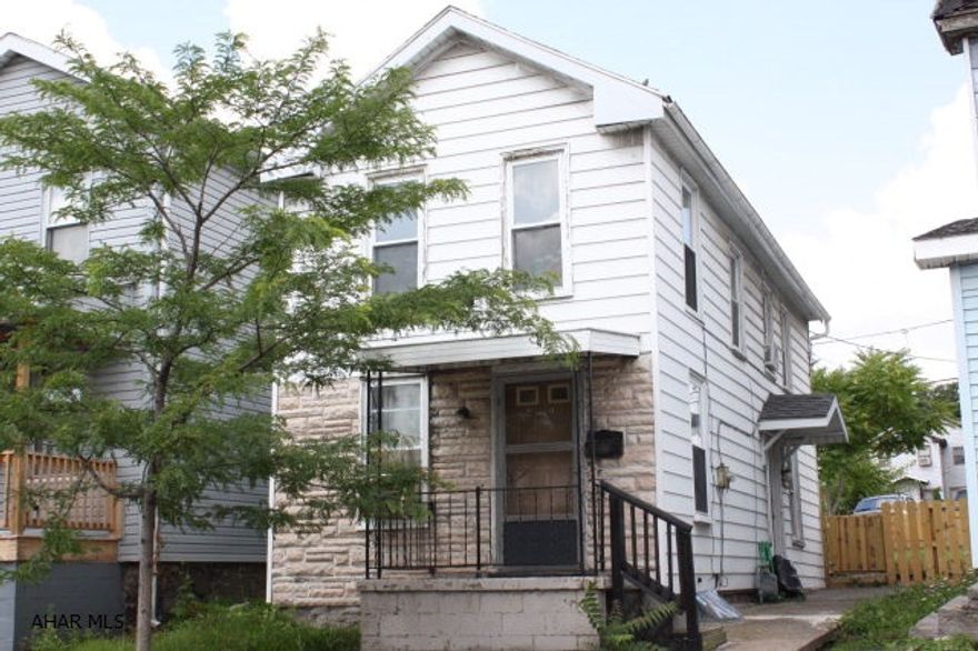 Attention Investors.   This house is already rented with an income of $500 dollars a month, tenant pays gas, electric, & garbage.  All the fix'ins have been done. Fresh paint, New carpet, new propane wall mount heating units, new floor in kitchen, updated bathroom, new 10x20 deck, new fencing, new 6x8 storage shed.  Water line from front street to house was repaired also.